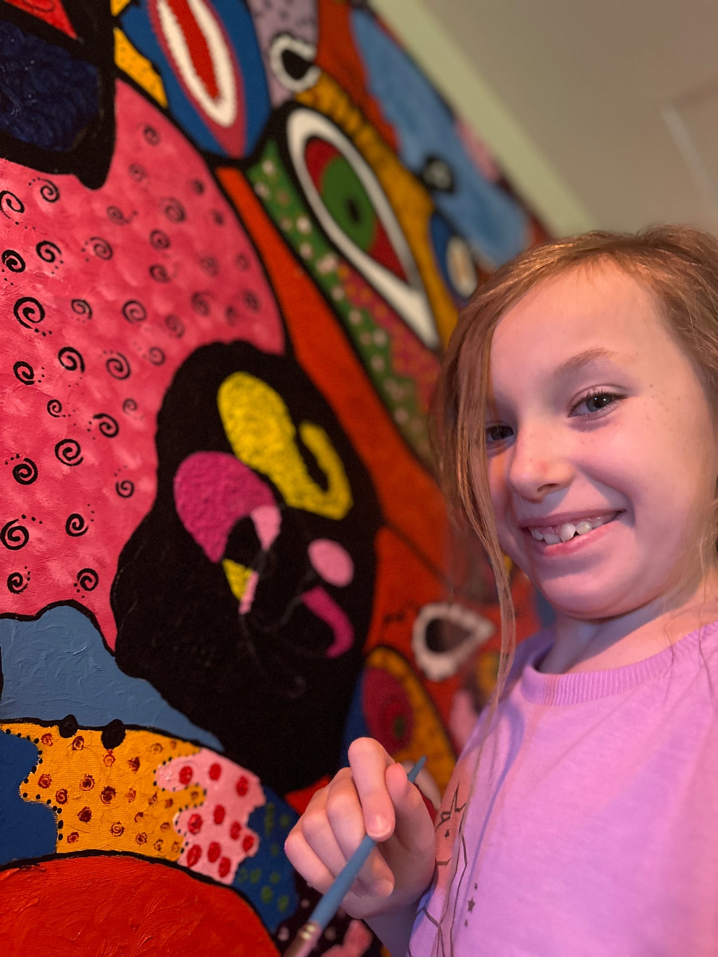 Kierah age 8 working on, "Faces of War III."